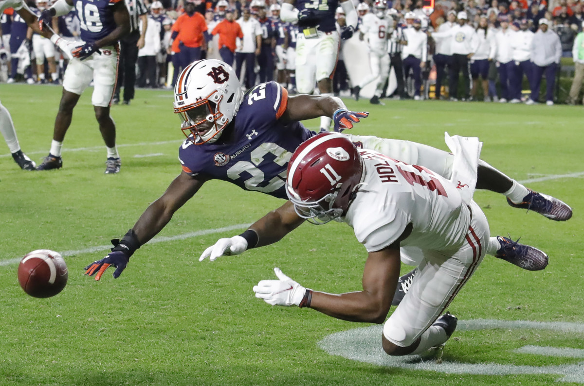 Nov 27, 2021; Auburn, Alabama, USA; Auburn Tigers cornerback Roger McCreary (23) breaks up a pass intended for Alabama Crimson Tide wide receiver Traeshon Holden (11) during the third quarter at Jordan-Hare Stadium. Mandatory Credit: John Reed-USA TODAY Sports