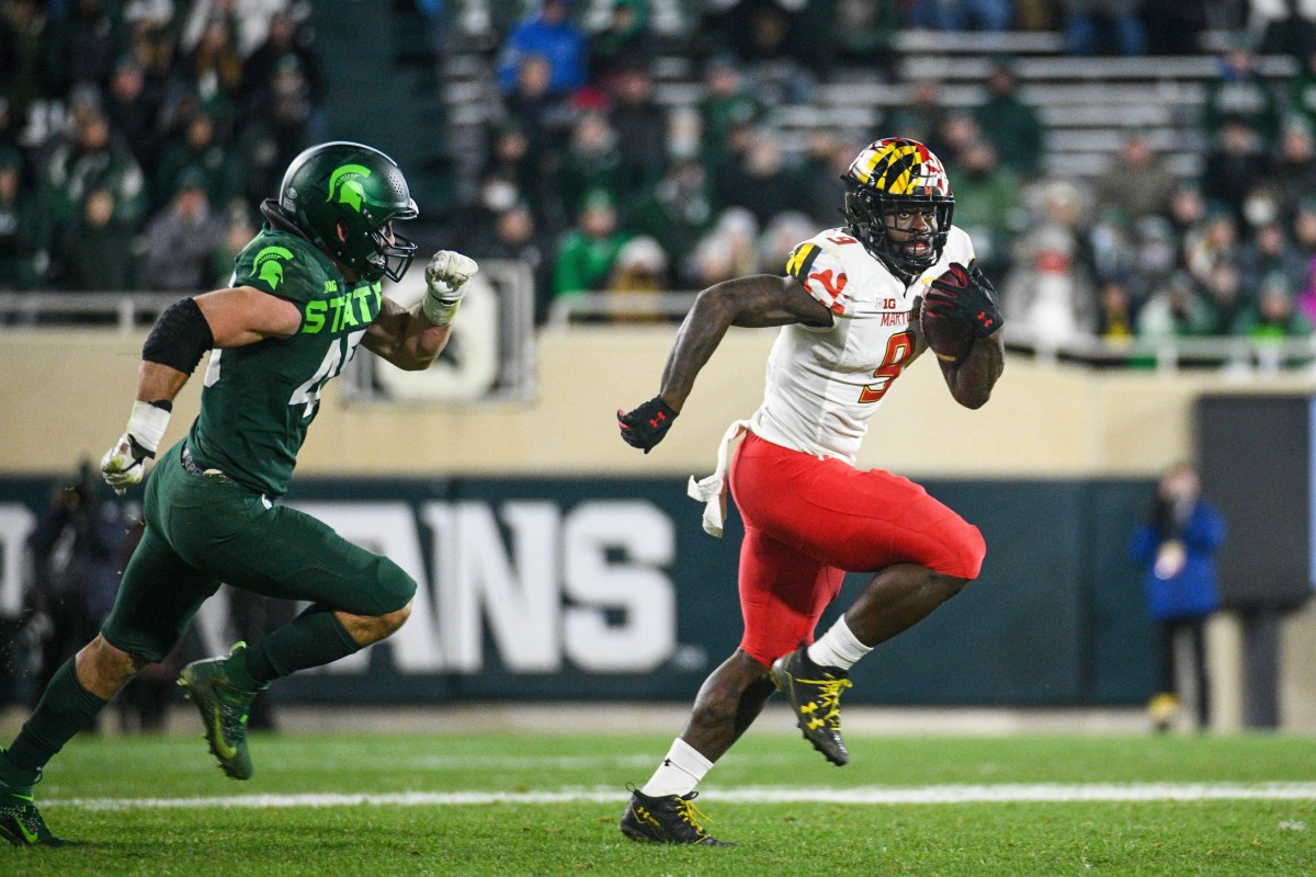 Maryland tight end Chigoziem Okonkwo (9) runs the ball as Michigan State linebacker Noah Harvey (45) pursues. Mandatory Credit: Tim Fuller-USA TODAY Sports