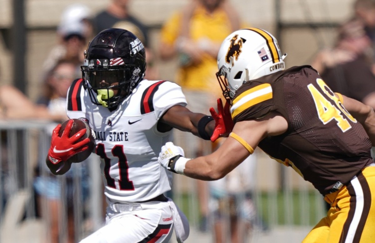 Ball State wide receiver Justin Hall (11) is tackled by Wyoming linebacker Chad Muma (48). Mandatory Credit: Troy Babbitt-USA TODAY Sports