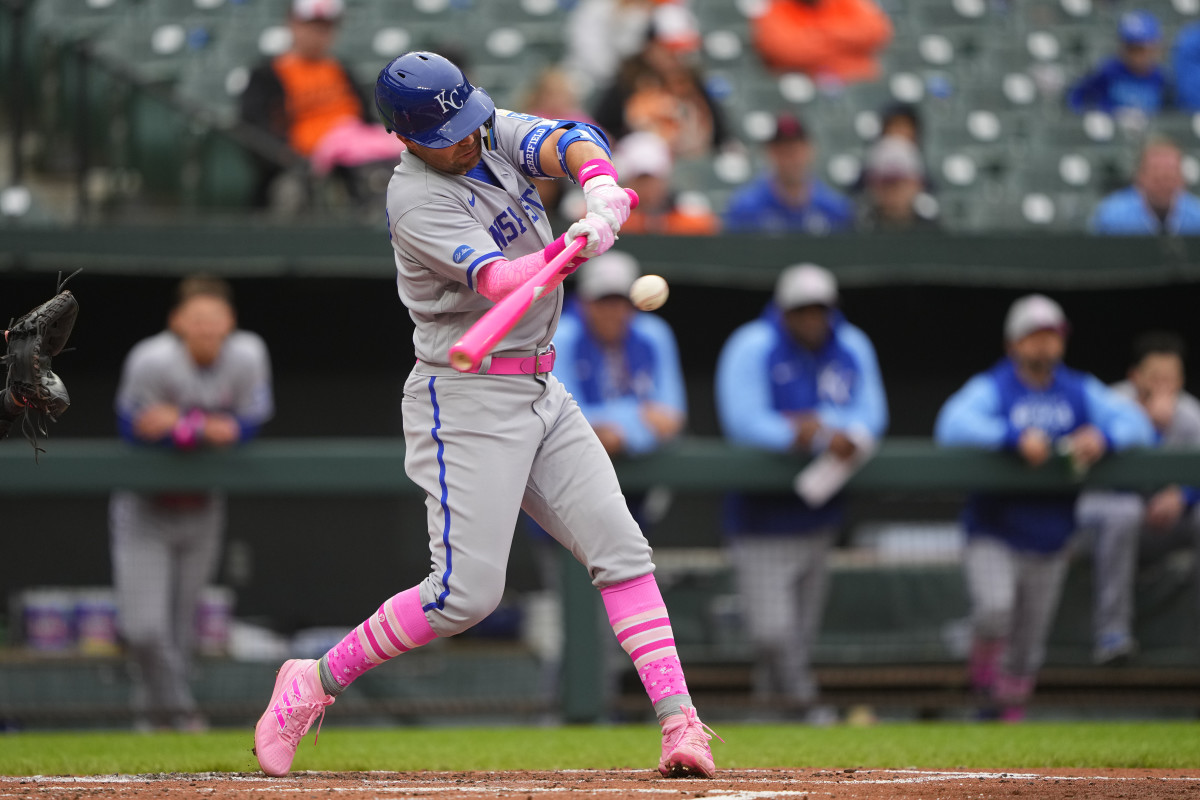 May 8, 2022; Baltimore, Maryland, USA; Kansas City Royals second baseman Whit Merrifield (15) hits a sacrifice fly ball to score a run against the Baltimore Orioles during the second inning at Oriole Park at Camden Yards. Mandatory Credit: Gregory Fisher-USA TODAY Sports