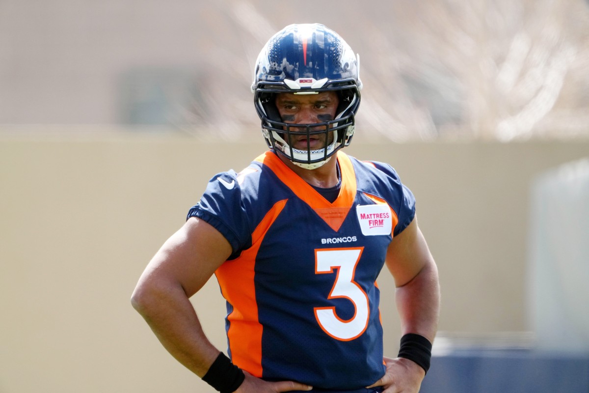Apr 25, 2022; Englewood, CO, USA; Denver Broncos quarterback Russell Wilson (3) looks on during a Denver Broncos mini camp at UCHealth Training Center. Mandatory Credit: Ron Chenoy-USA TODAY Sports