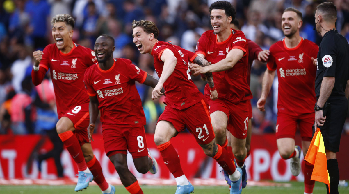 Kostas Tsimikas of Liverpool celebrates after scoring the winning penalty in the shoot out with his team mates