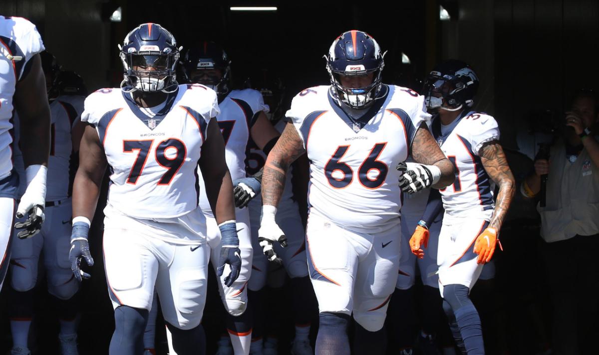 Denver Broncos center Lloyd Cushenberry (79) and guard Dalton Risner (66) lead the team out of the tunnel to play the Pittsburgh Steelers at Heinz Field.