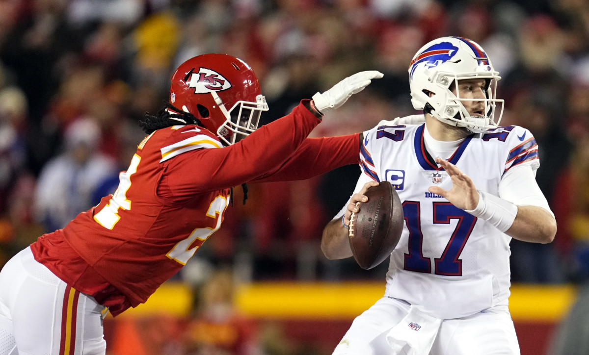 Jan 23, 2022; Kansas City, Missouri, USA; Buffalo Bills quarterback Josh Allen (17) drops back to pass under pressure from Kansas City Chiefs linebacker Melvin Ingram (24) during the first quarter in the AFC Divisional playoff football game at GEHA Field at Arrowhead Stadium. Mandatory Credit: Jay Biggerstaff-USA TODAY Sports