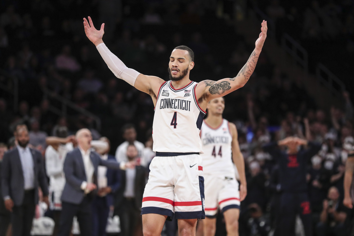Connecticut Huskies guard Tyrese Martin (4) waves to the crowd in the second half against the Seton Hall Pirates at the Big East Tournament at Madison Square Garden.
