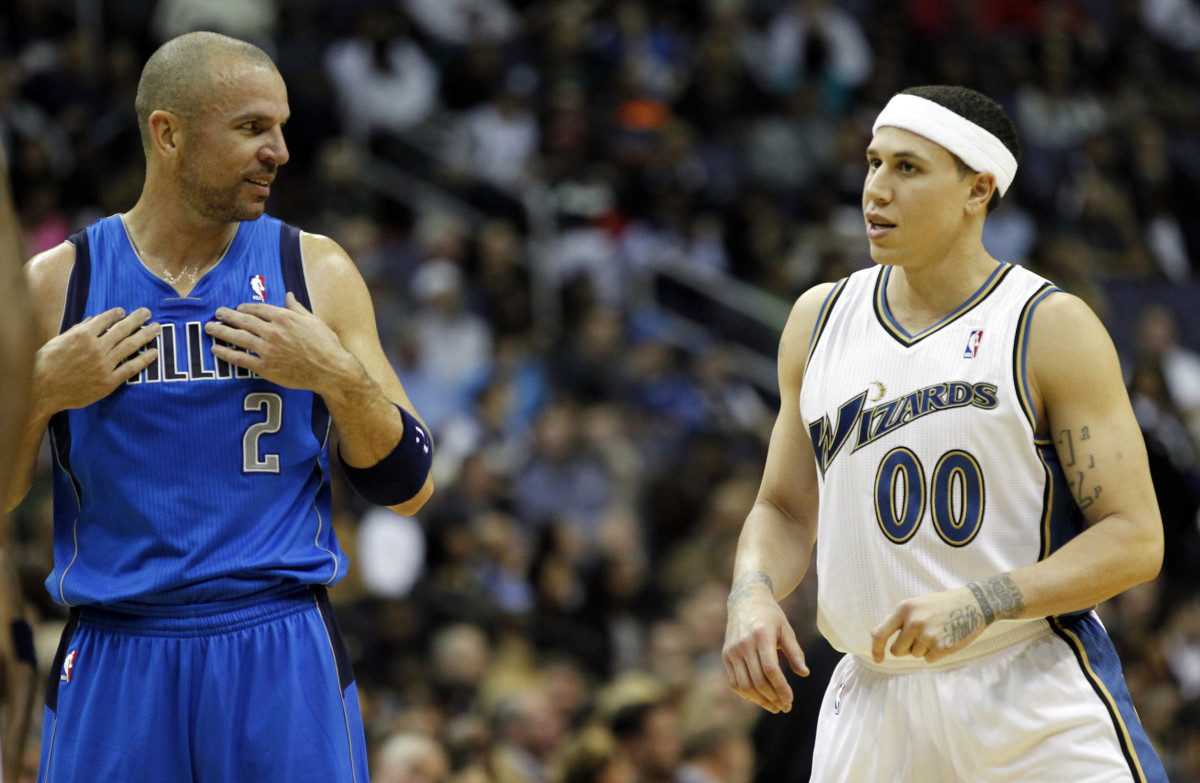 Dallas Mavericks point guard Jason Kidd (2) talks with Washington Wizards point guard Mike Bibby (0) in the first half at Verizon Center.