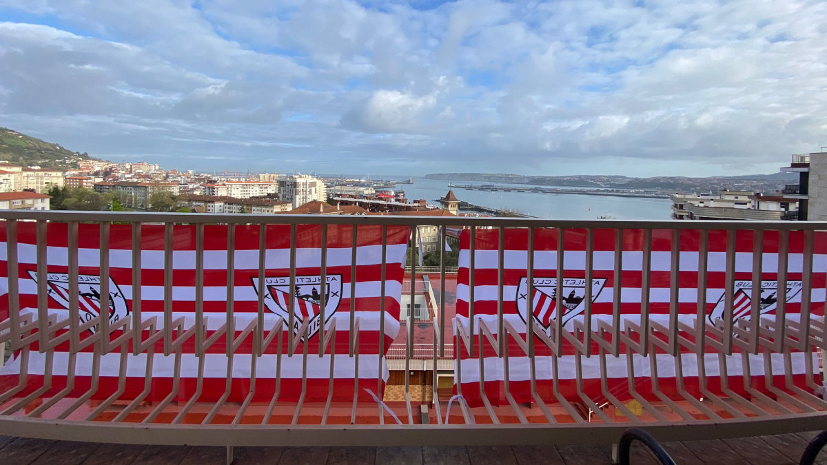 Athletic Bilbao banners hang on city balconies in anticipation of two Copa del Rey finals