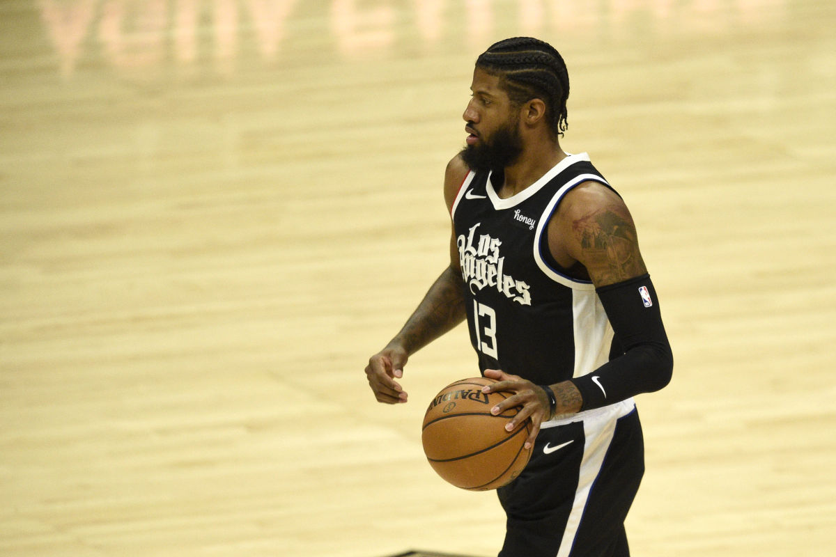 Mar 27, 2021; Los Angeles, California, USA; LA Clippers guard Paul George (13) takes the ball down the court during the first half against the Philadelpha 76ers at Staples Center. Mandatory Credit: Kelvin Kuo-USA TODAY Sports