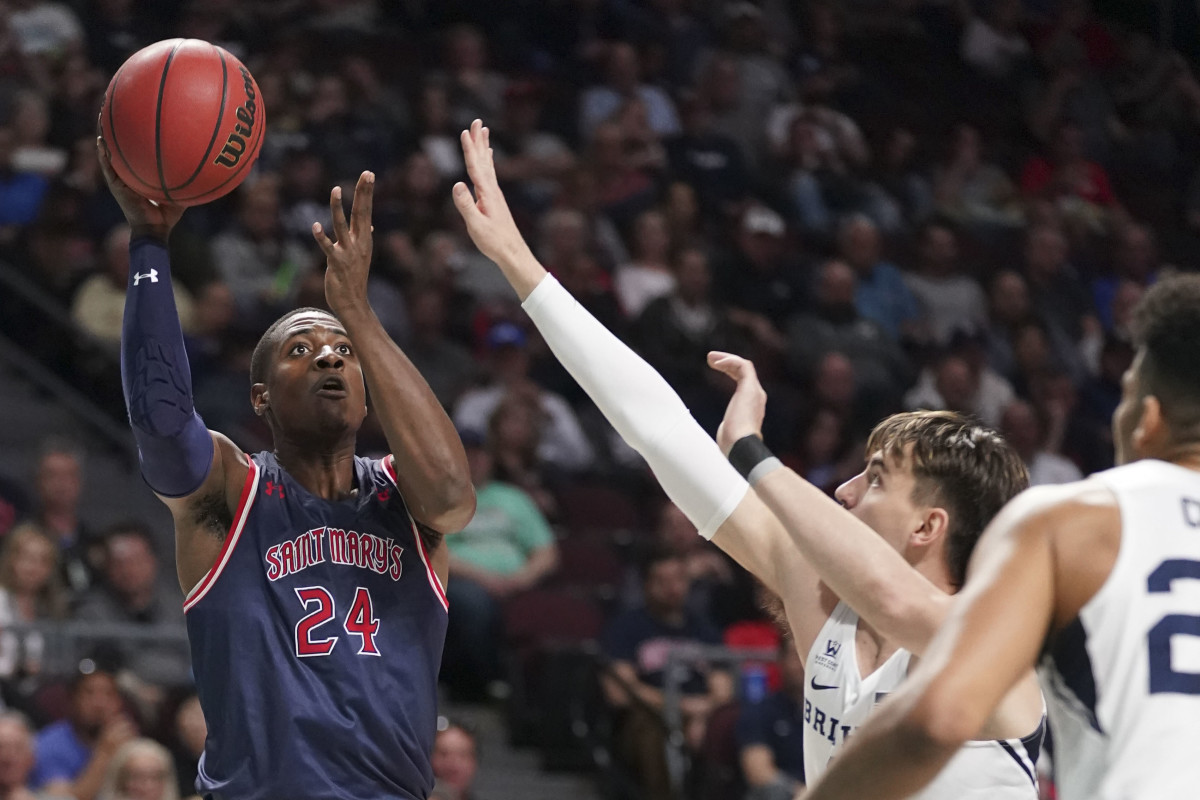 March 9, 2020; Las Vegas, NV, USA; Saint Mary's Gaels forward Malik Fitts (24) shoots the basketball against BYU Cougars guard Zac Seljaas (2) during the first half during the semifinal game in the WCC Basketball Championships at Orleans Arena. Mandatory Credit: Kyle Terada-USA TODAY Sports