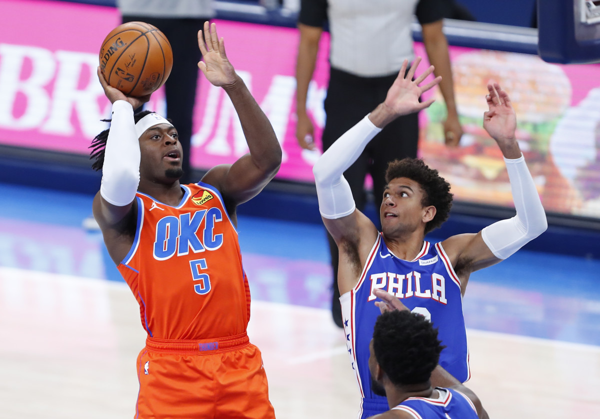 OKC's Luguentz Dort shoots the ball over Philadelphia's Matisse Thybulle