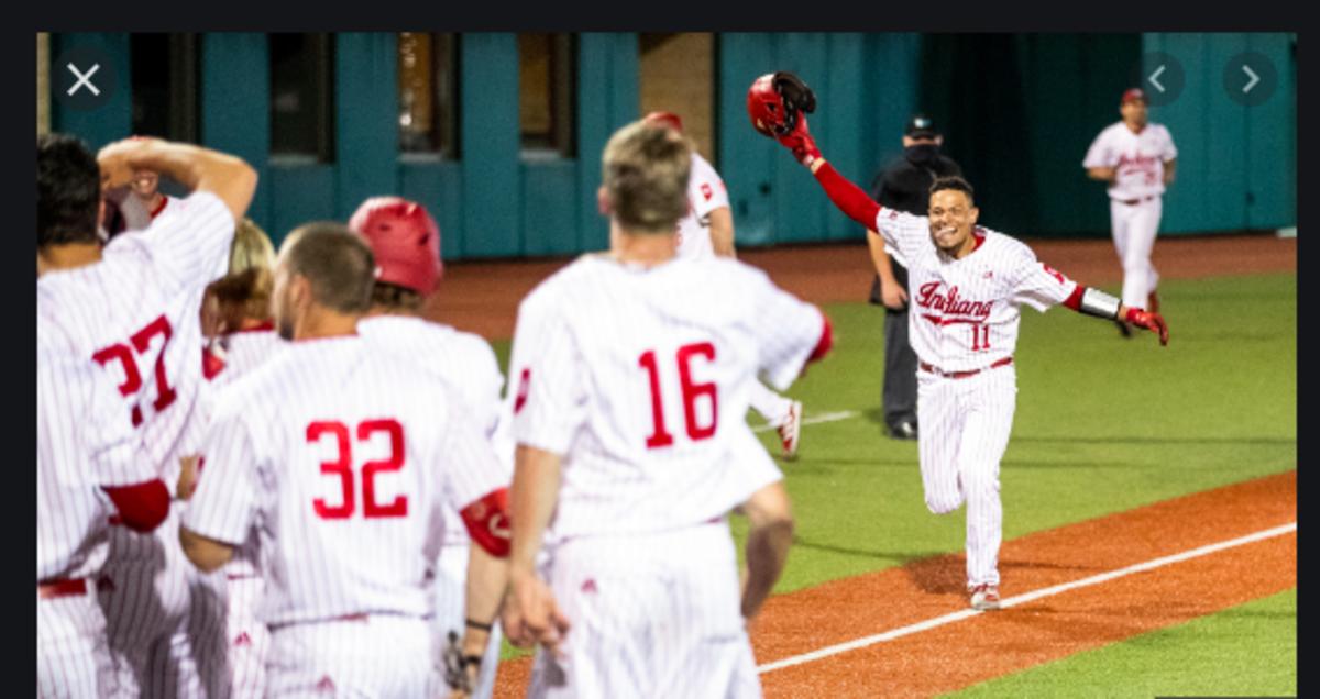Collin Hopkins' teammates prepare tomob him after his walk-off home run last Friday night against Illinois. (Photo courtesy of IU Athletics.)