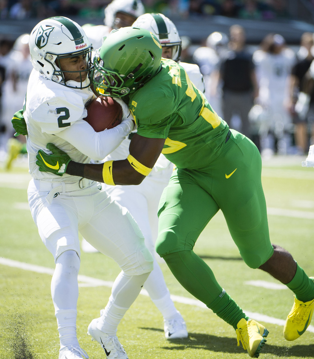 Adrian Jackson tackles wide receiver Antwone Williams in a game against Portland State in 2018. 