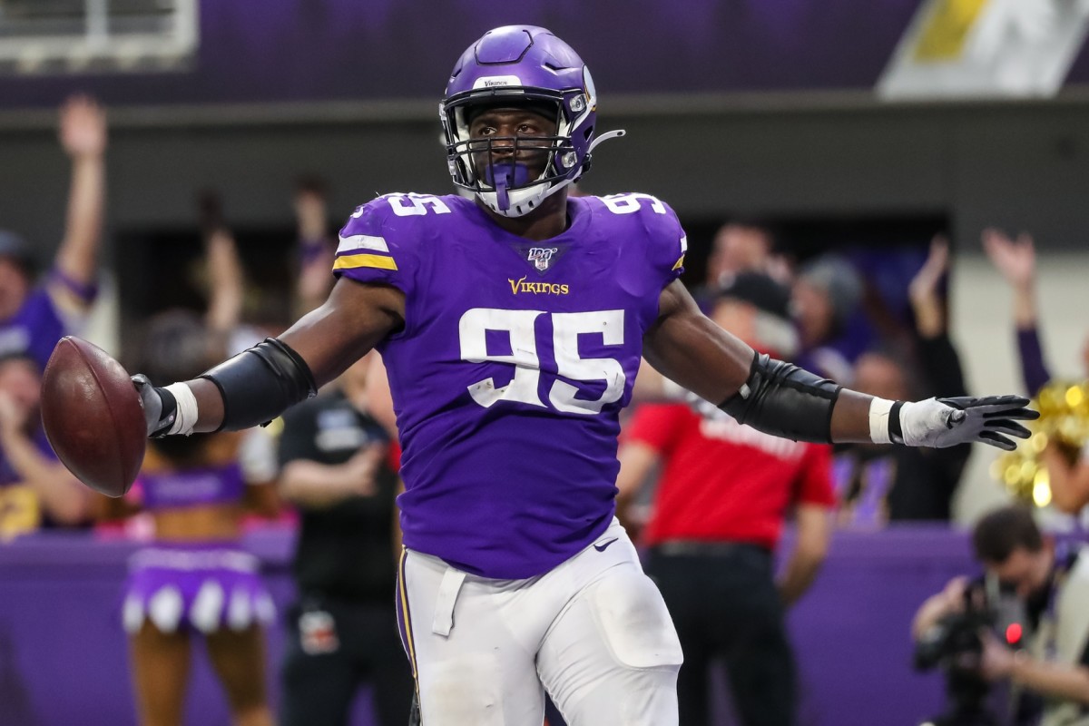 Dec 29, 2019; Minneapolis, Minnesota, USA; Minnesota Vikings defensive end Ifeadi Odenigbo (95) celebrates his fumble recovery during the fourth quarter against the Chicago Bears at U.S. Bank Stadium.