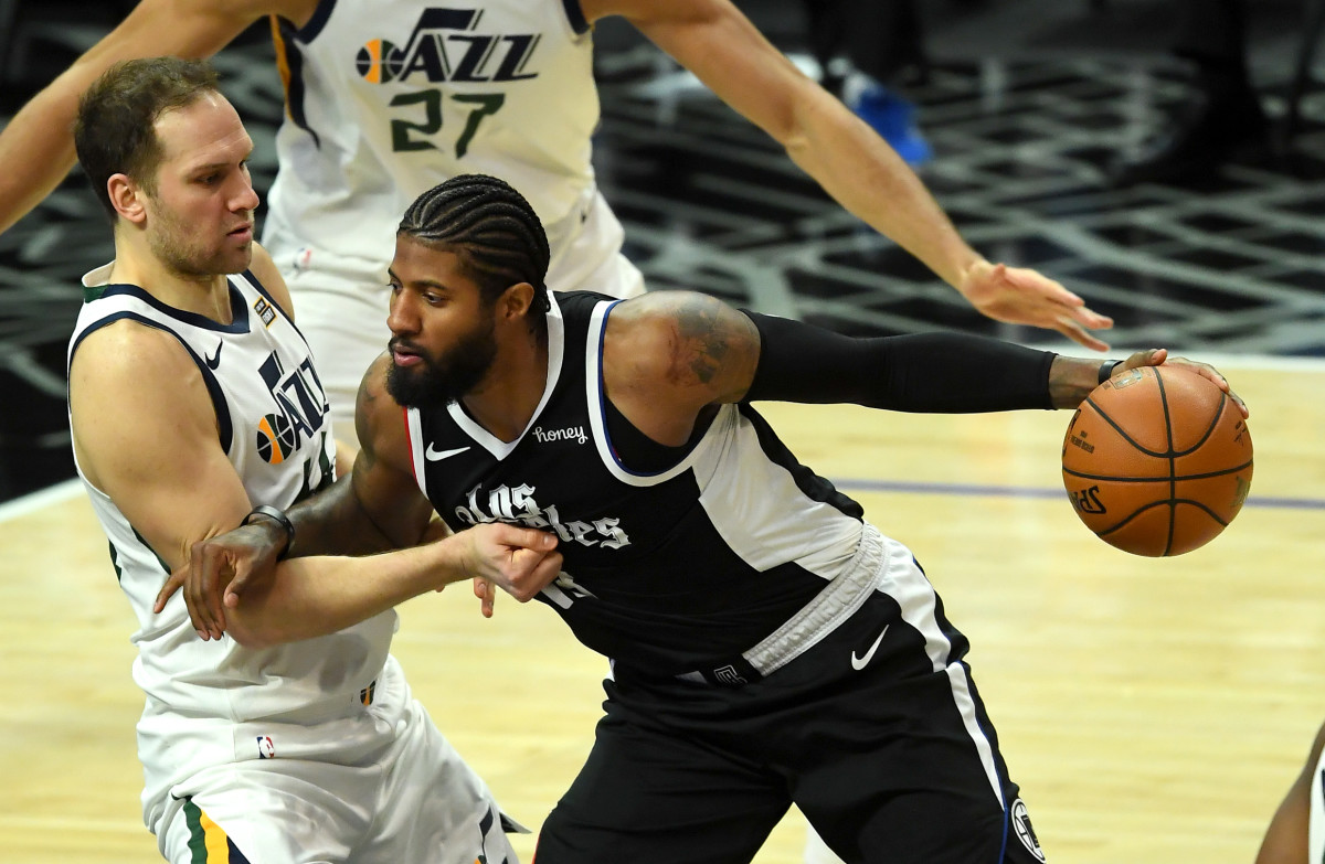 Feb 19, 2021; Los Angeles, California, USA; Utah Jazz forward Bojan Bogdanovic (44) defends Los Angeles Clippers guard Paul George (13) as he drives to the basket in the second half of the game at Staples Center. Mandatory Credit: Jayne Kamin-Oncea-USA TODAY Sports