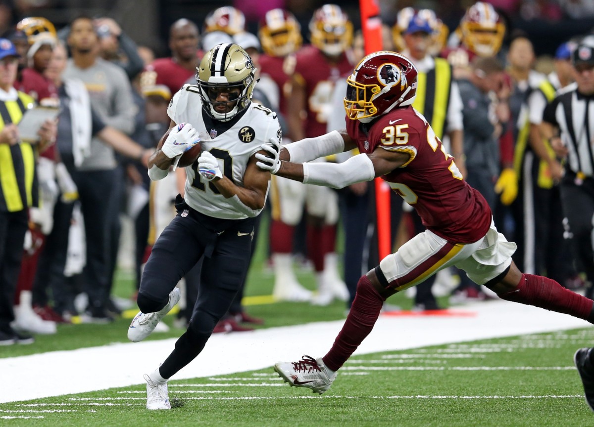 New Orleans receiver Tre'Quan Smith (10) runs for a touchdown against Redskins safety Montae Nicholson (35). Saints quarterback Drew Brees (not pictured) set the all-time NFL passing yardage mark on this play. Mandatory Credit: Chuck Cook-USA TODAY 