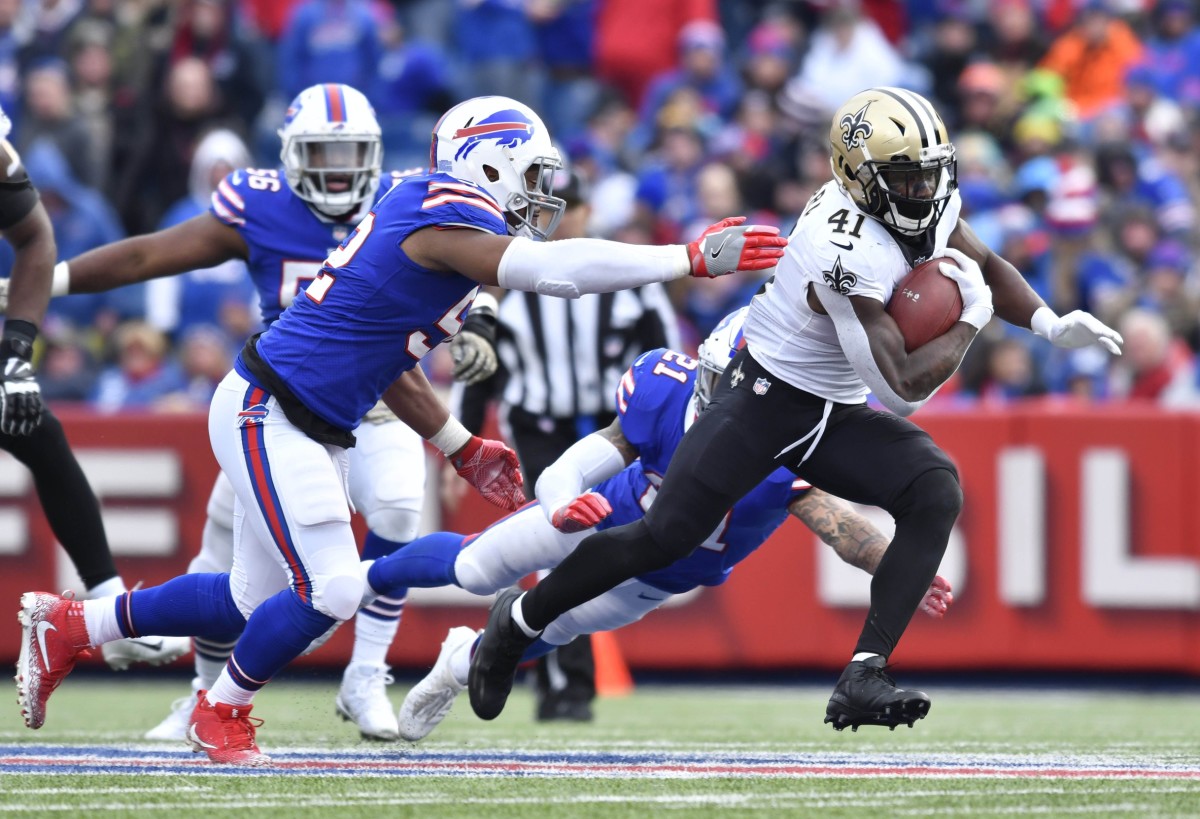 New Orleans Saints running back Alvin Kamara (41) runs past Buffalo linebacker Preston Brown (52). Mandatory Credit: Mark Konezny-USA TODAY Sports