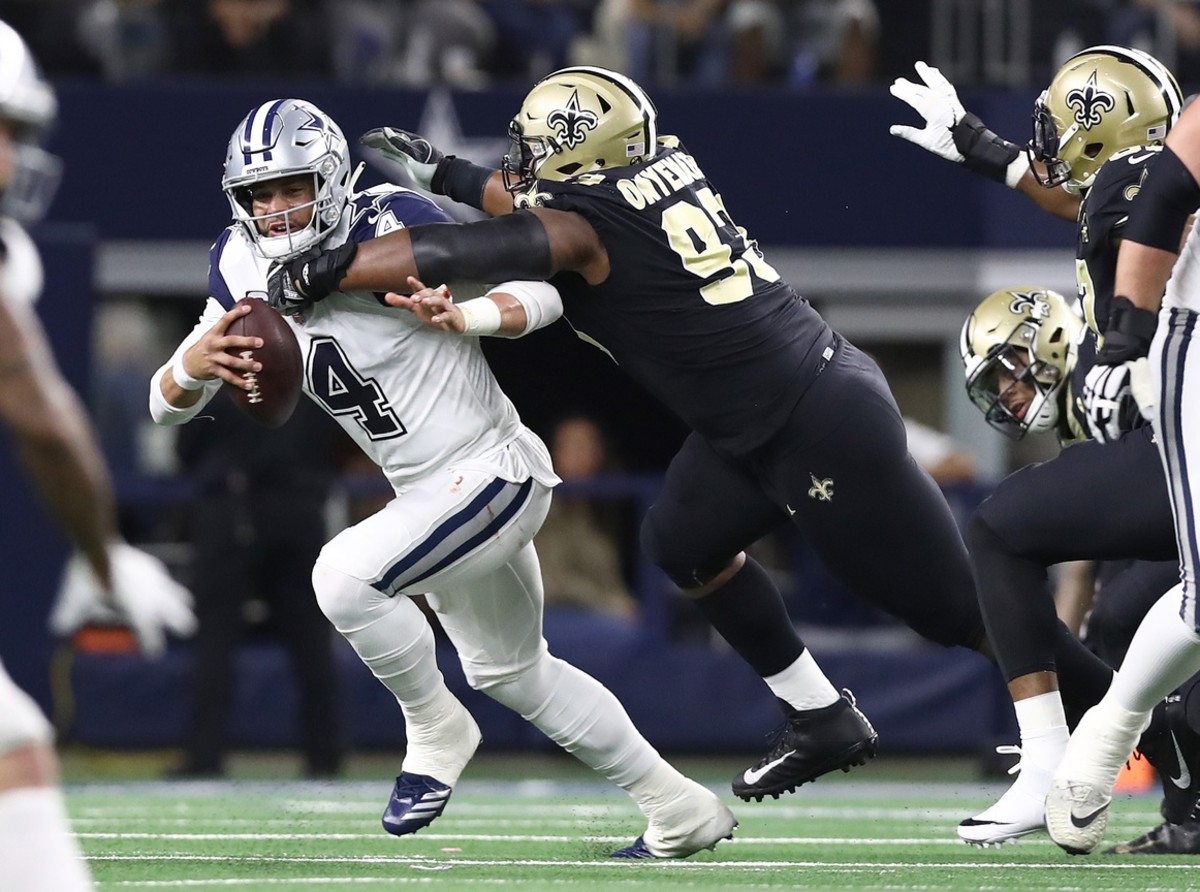 Dallas quarterback Dak Prescott (4) is sacked by New Orleans Saints defensive tackle David Onyemata (93). Mandatory Credit: Matthew Emmons-USA TODAY Sports