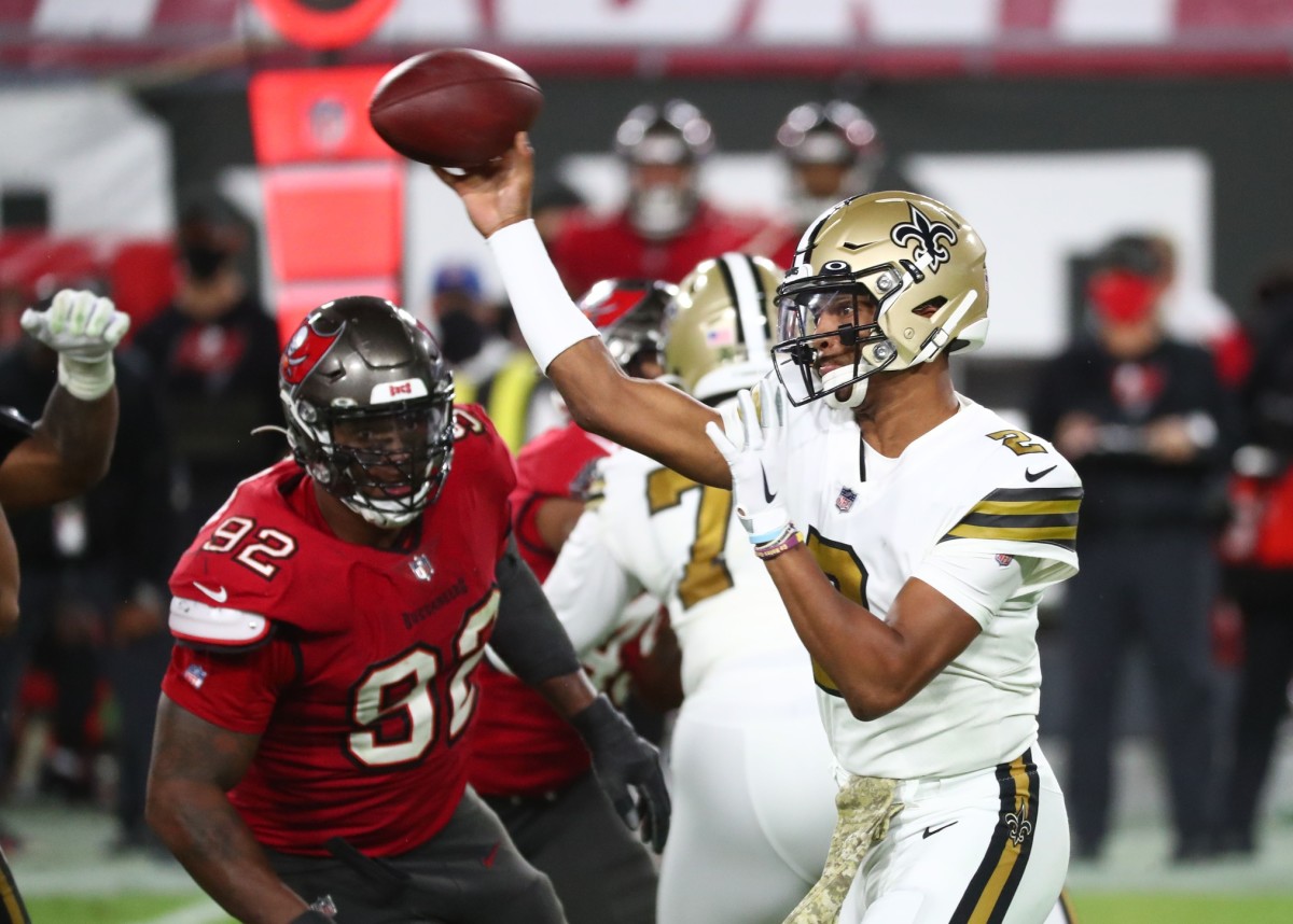 New Orleans Saints quarterback Jameis Winston (2) throws as Tampa Bay defensive end William Gholston (92) rushes. Mandatory Credit: Kim Klement-USA TODAY Sports