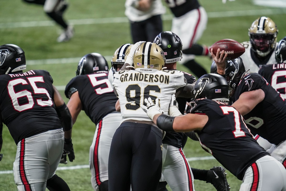 Saints defensive end Carl Granderson (96) hits Atlanta quarterback Matt Ryan (2) causing a fumble recovered by the Saints. Mandatory Credit: Dale Zanine-USA TODAY