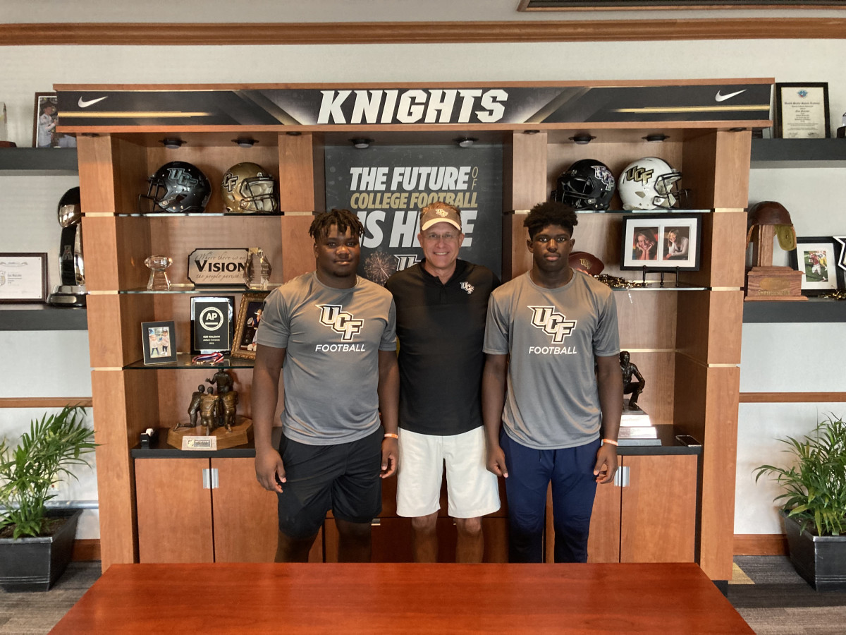 Tavaras Capers and Daylen Russell with Gus Malzahn
