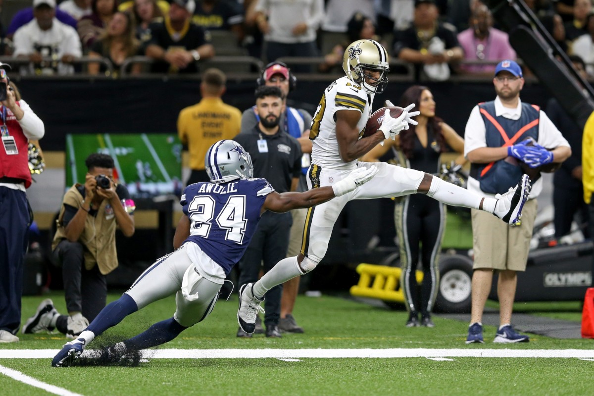 New Orleans Saints receiver Michael Thomas (13) makes a catch in front of Cowboys cornerback Chidobe Awuzie (24). Mandatory Credit: Chuck Cook-USA TODAY 