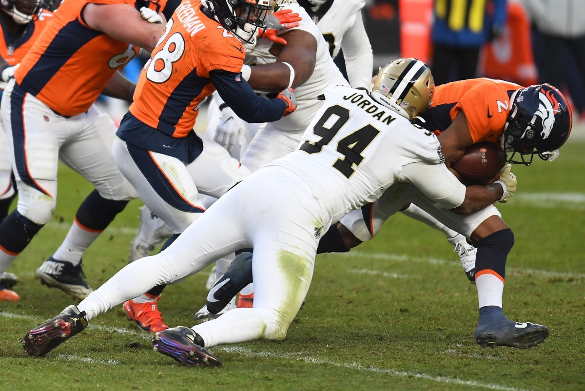 New Orleans Saints defensive end Cameron Jordan (94) sacks Denver quarterback Kendall Hinton (2). Mandatory Credit: Ron Chenoy-USA TODAY