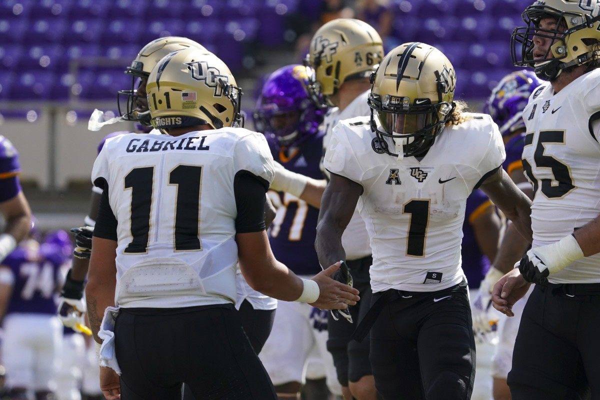 Jaylon Robinson congratulated by quarterback Dillon Gabriel after scoring a second half touchdown versus East Carolina.