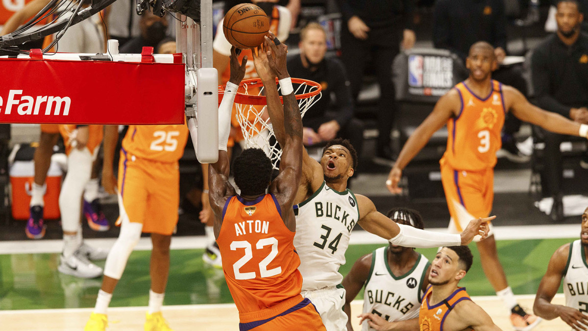 Milwaukee Bucks forward Giannis Antetokounmpo defends Phoenix Suns center Deandre Ayton during the fourth quarter during game four of the 2021 NBA Finals.