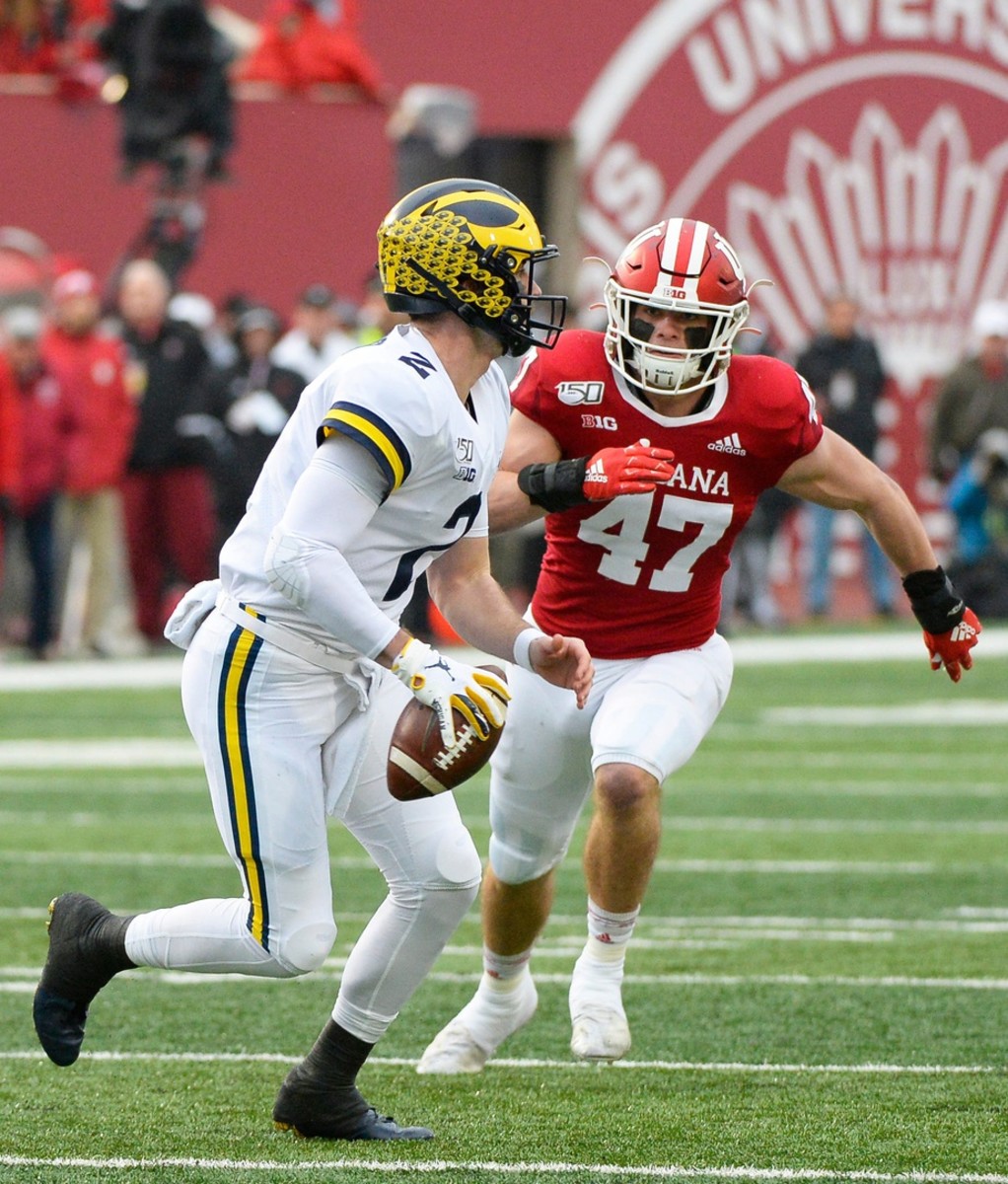 Indiana linebacker Micah McFadden chases down Michigan quarterback Shea Patterson. (Photo by USA Today).