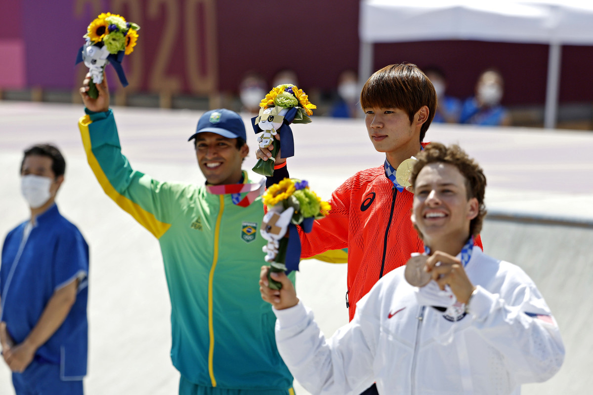Brazil's Kelvin Hoefler with gold medalist Yuto Horigome of Japan and silver medalist Jagger Eaton of the U.S.