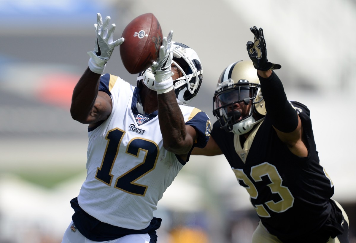 Rams receiver Brandin Cooks (12) catches a pass against Saints cornerback Marshon Lattimore (23). Mandatory Credit: Gary A. Vasquez-USA TODAY 