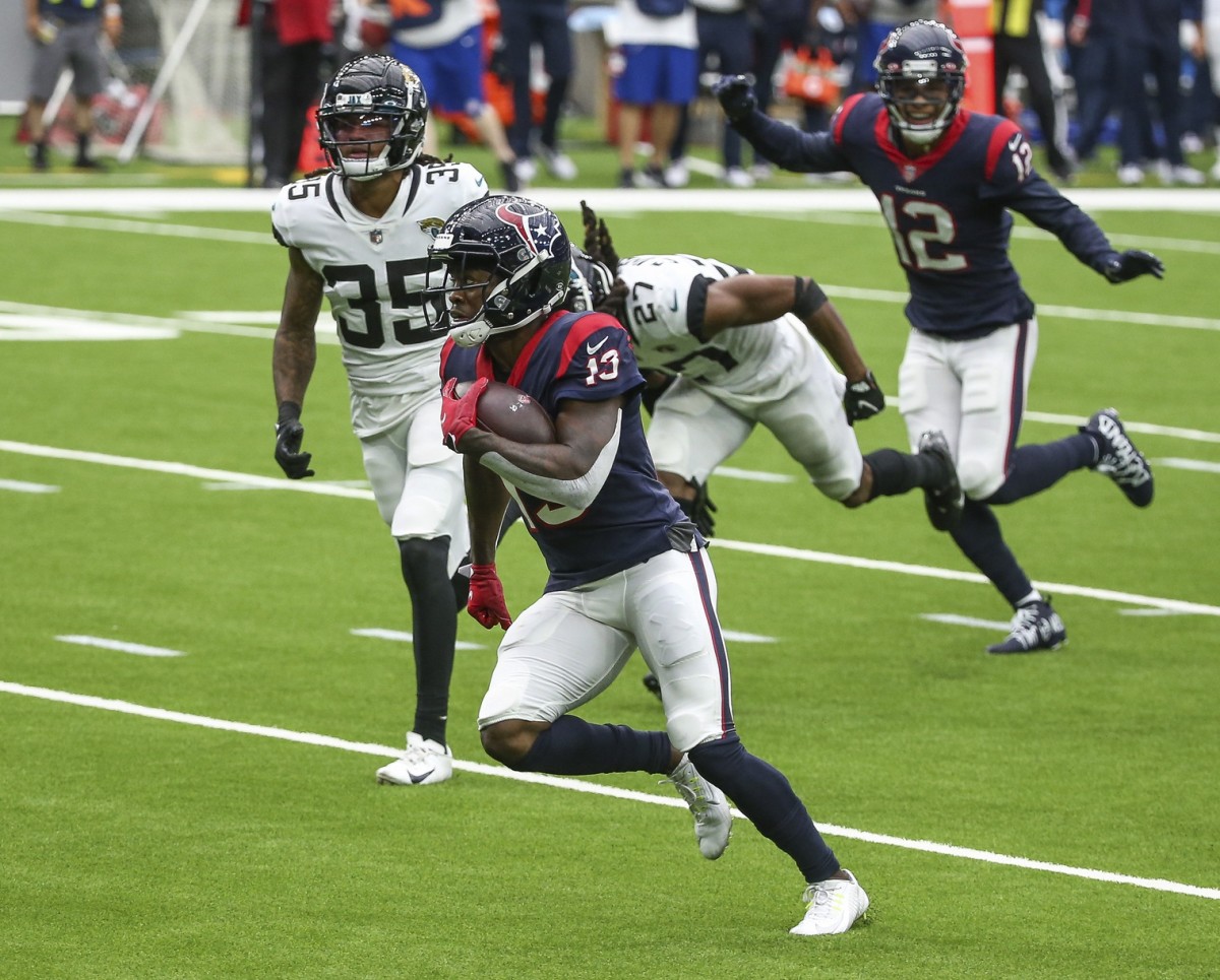 Houston Texans receiver Brandin Cooks (13) runs after a reception and scores a touchdown against Jacksonville. Mandatory Credit: Troy Taormina-USA TODAY Sports