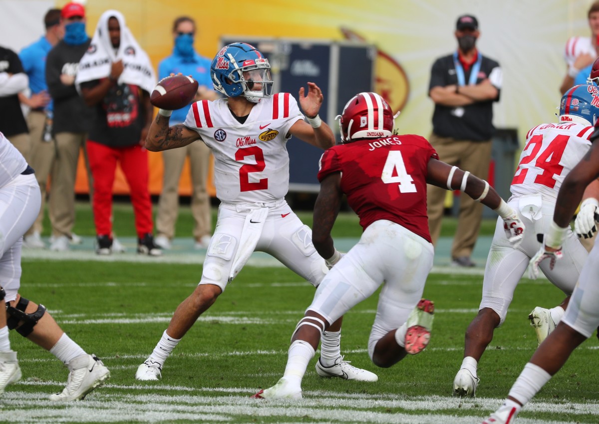 Jan 2, 2021; Tampa, FL, USA; Mississippi Rebels quarterback Matt Corral (2) throws he ball as Indiana Hoosiers linebacker Cam Jones (4) rushes during the second half at Raymond James Stadium.