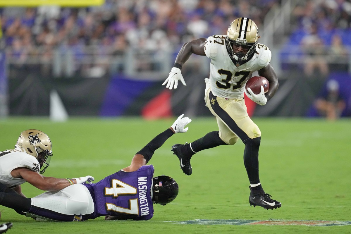 New Orleans Saints running back Tony Jones Jr. (37) runs for a gain defended by Baltimore safety Ar Darius Washington (47). Mandatory Credit: Mitch Stringer-USA TODAY