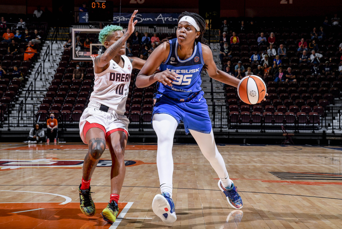 Jonquel Jones dribbles the basketball against the Atlanta Dream