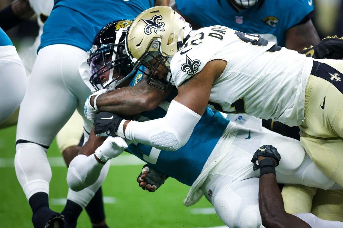 New Orleans Saints defensive end Marcus Davenport (92) tackles Jaguars running back Nathan Cottrell (31). Mandatory Credit: Stephen Lew-USA TODAY Sports