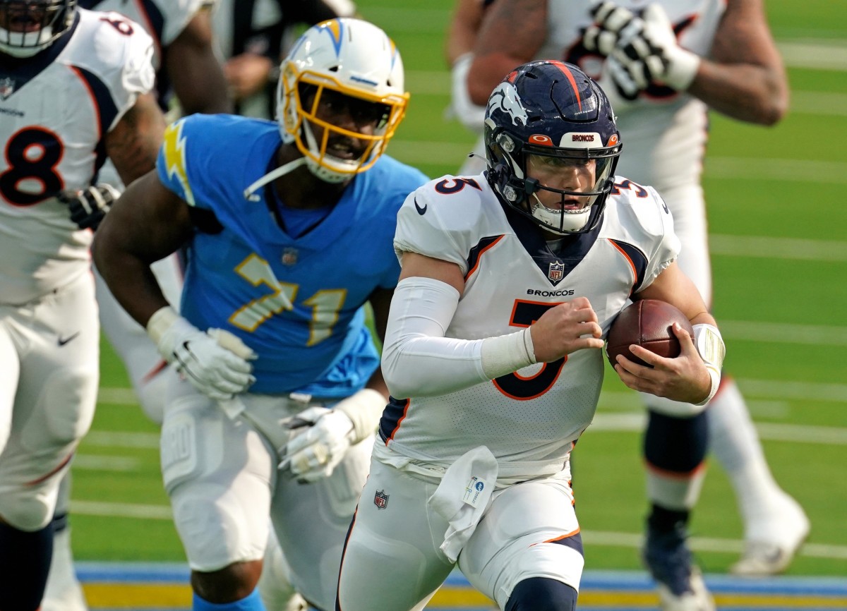 Denver Broncos quarterback Drew Lock (3) runs with the ball as Chargers Damion Square (71) pursues. Mandatory Credit: Kirby Lee-USA TODAY Sports