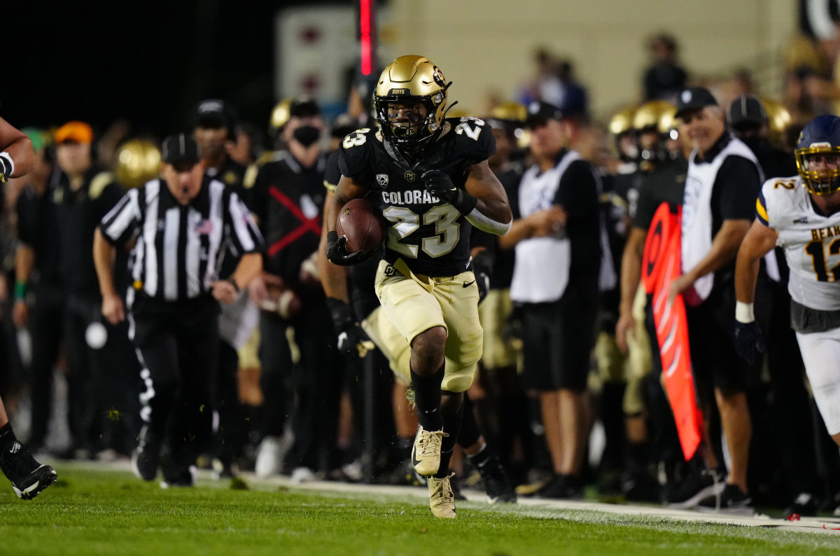Colorado running back Jarek Broussard (23) runs down the sideline for a big gain.
