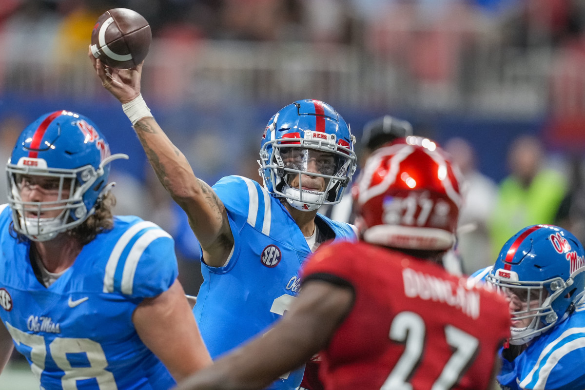 Matt Corral throwing a football for Rebel touchdown