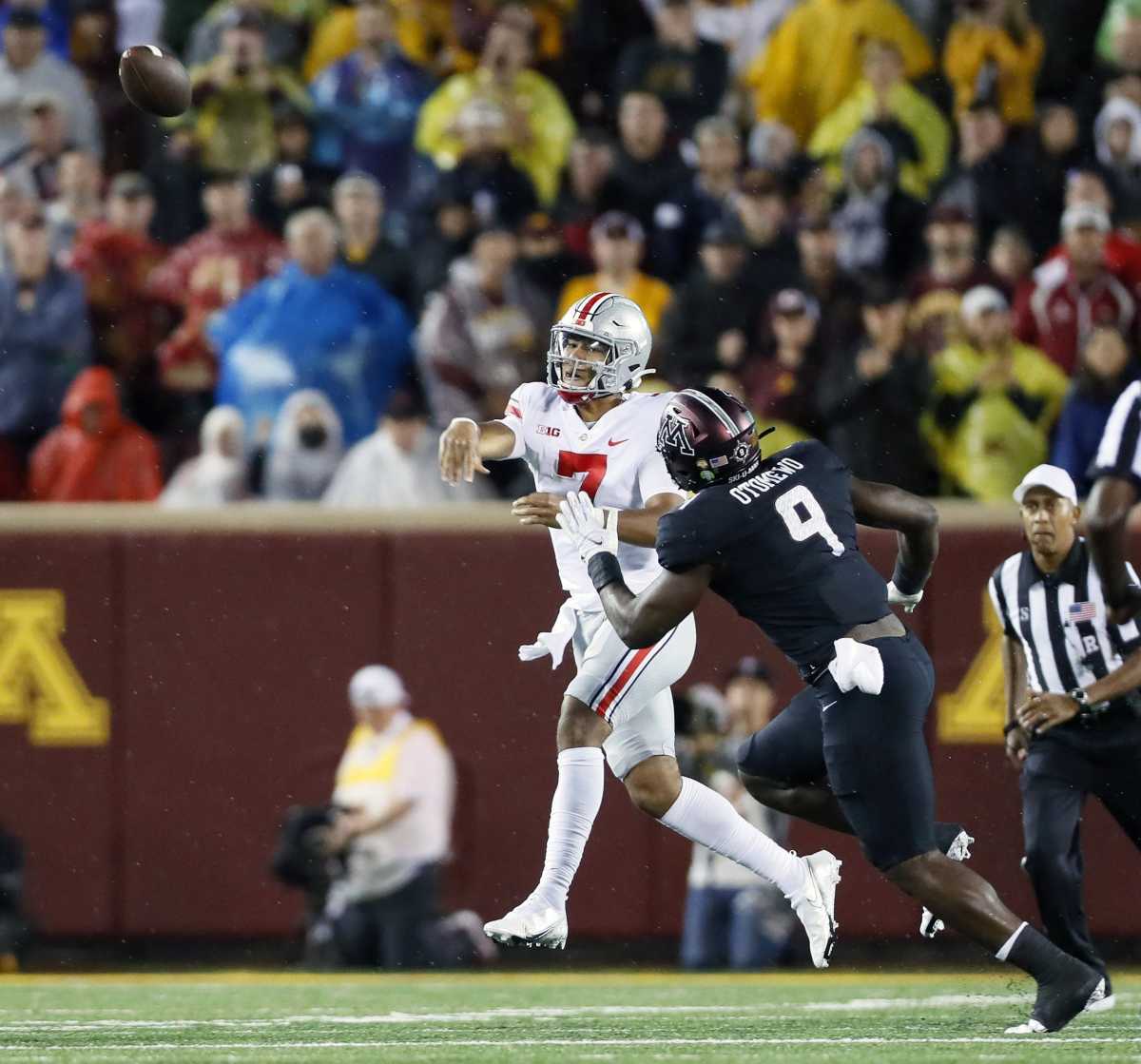 Ohio State quarterback CJ Stroud throws on the run against the Minnesota Golden Gophers.