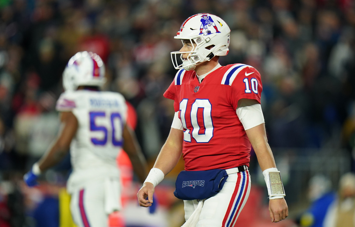 Dec 1, 2022; Foxborough, Massachusetts, USA; New England Patriots quarterback Mac Jones (10) returns to the sideline as they take on the Buffalo Bills in the second quarter at Gillette Stadium.