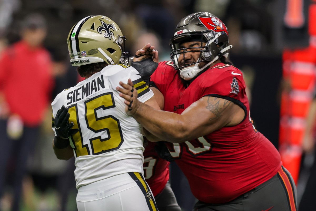 Oct 31, 2021; Tampa Bay Buccaneers defensive tackle Vita Vea (50) hits New Orleans Saints quarterback Trevor Siemian (15) after a pass. Mandatory Credit: Stephen Lew-USA TODAY
