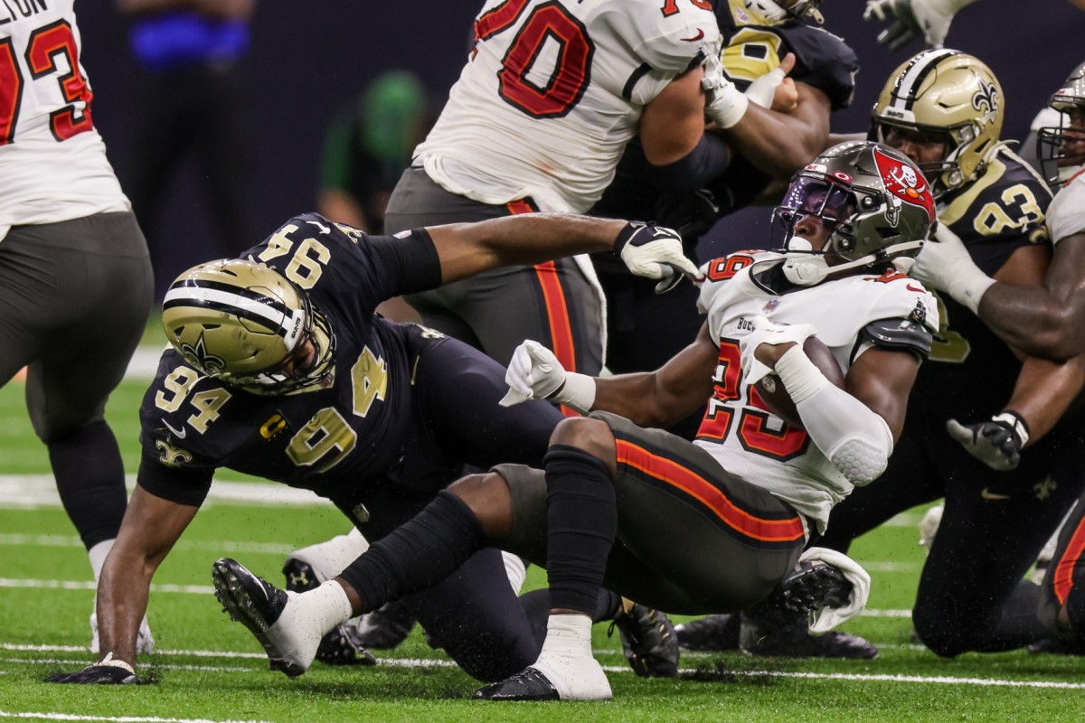 Sep 18, 2022; New Orleans Saints defensive end Cameron Jordan (94) stops Tampa Bay Buccaneers running back Rachaad White (29). Mandatory Credit: Stephen Lew-USA TODAY