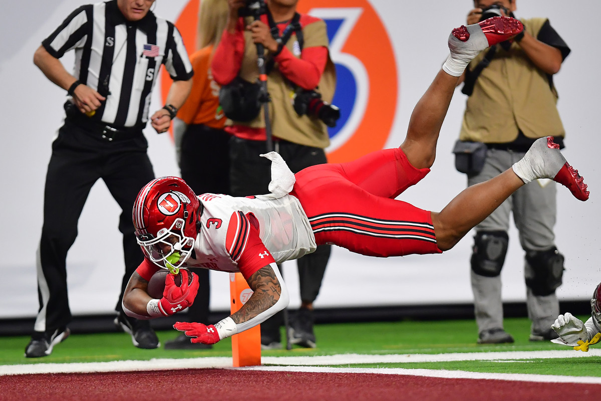 Utah Utes quarterback Ja'Quinden Jackson (3) runs the ball for a touchdown against the Southern California Trojans during the second half of the PAC-12 Football Championship at Allegiant Stadium.