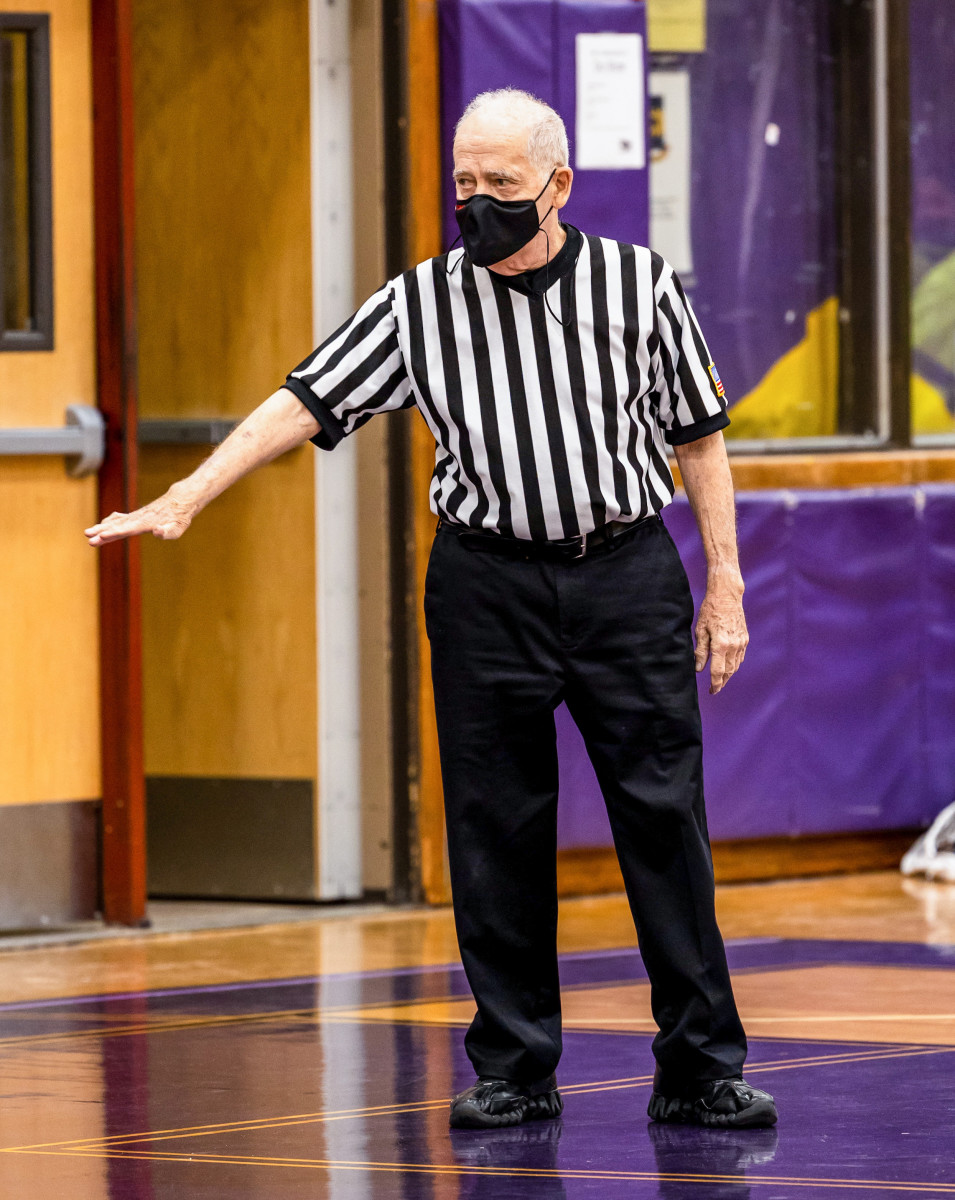 Longtime Newsday baseball writer Joe Donnelly referees a youth basketball game.