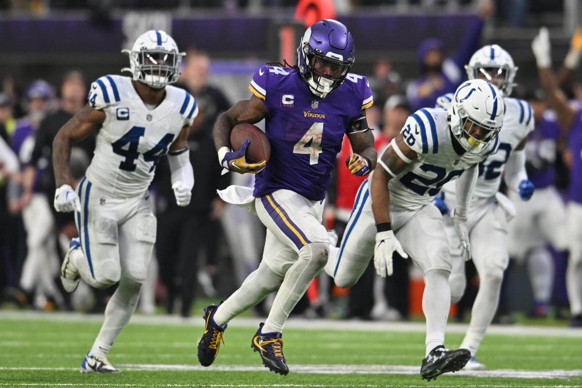 Dec 17, 2022; Minneapolis, Minnesota, USA; Minnesota Vikings running back Dalvin Cook (4) scores on a touchdown reception as Indianapolis Colts linebacker Zaire Franklin (44) and safety Rodney McLeod (26) pursue late during the fourth quarter at U.S. Bank Stadium.