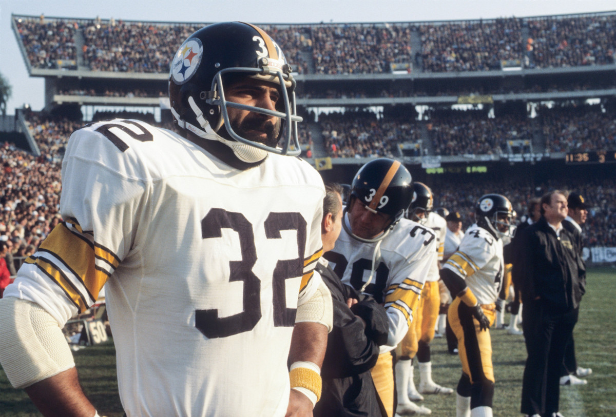 Franco Harris looks out at the field from the Steelers sideline during his playing days