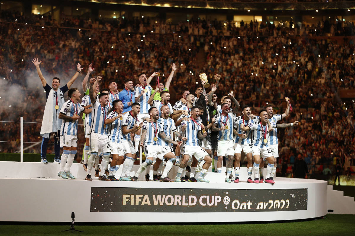 The Argentina team pictured celebrating with their trophy after winning the 2022 FIFA World Cup in Qatar