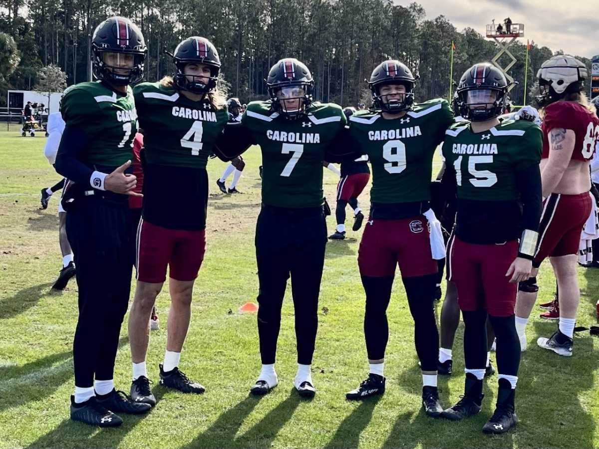 The quarterback group got together for a photo.