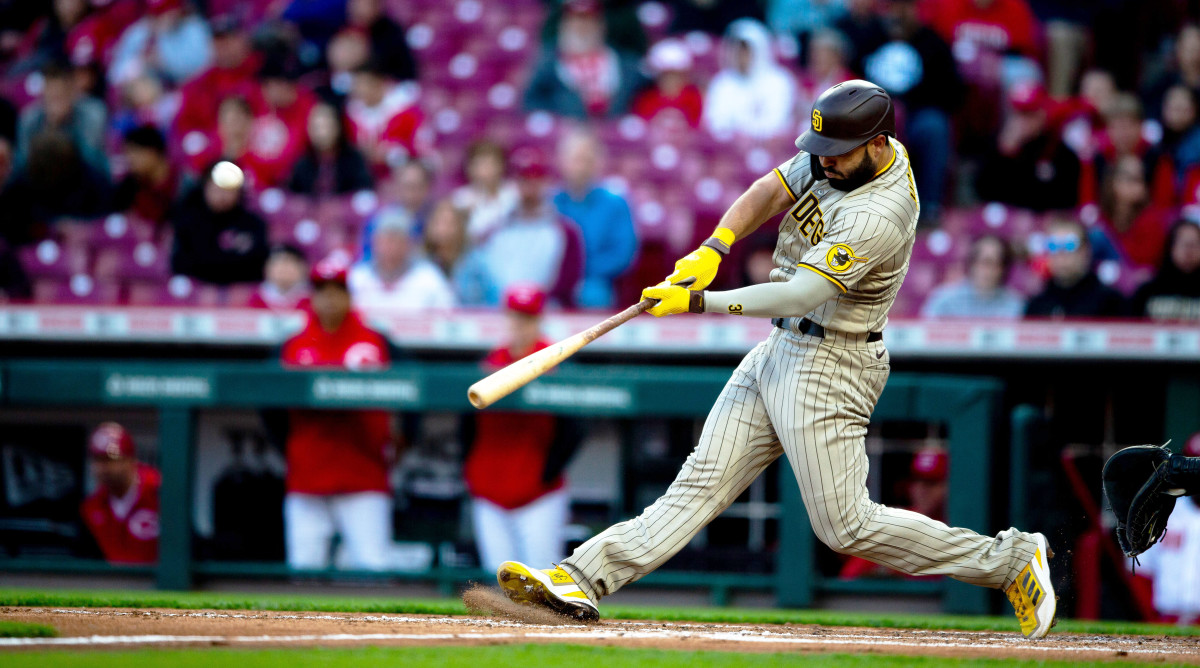 Padres first baseman Eric Hosmer hits a two-run home run in the fourth inning against the Reds at Great American Ball Park in Cincinnati on Tuesday, April 26, 2022.